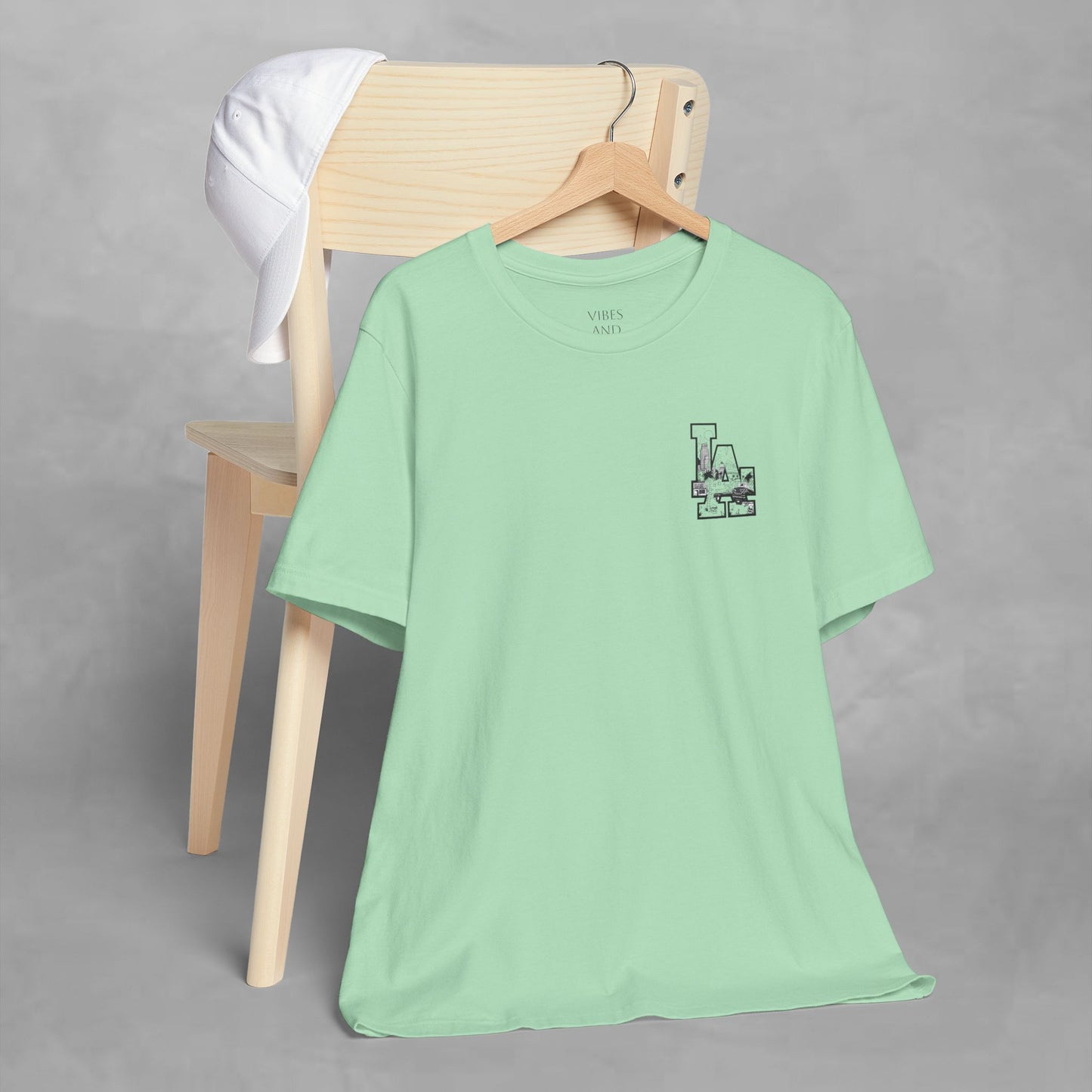 Minimalist Cityscape Pocket Tee — Small Black Line Art Chest Print