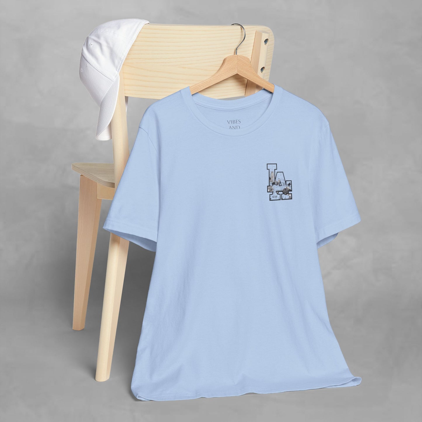 Minimalist Cityscape Pocket Tee — Small Black Line Art Chest Print