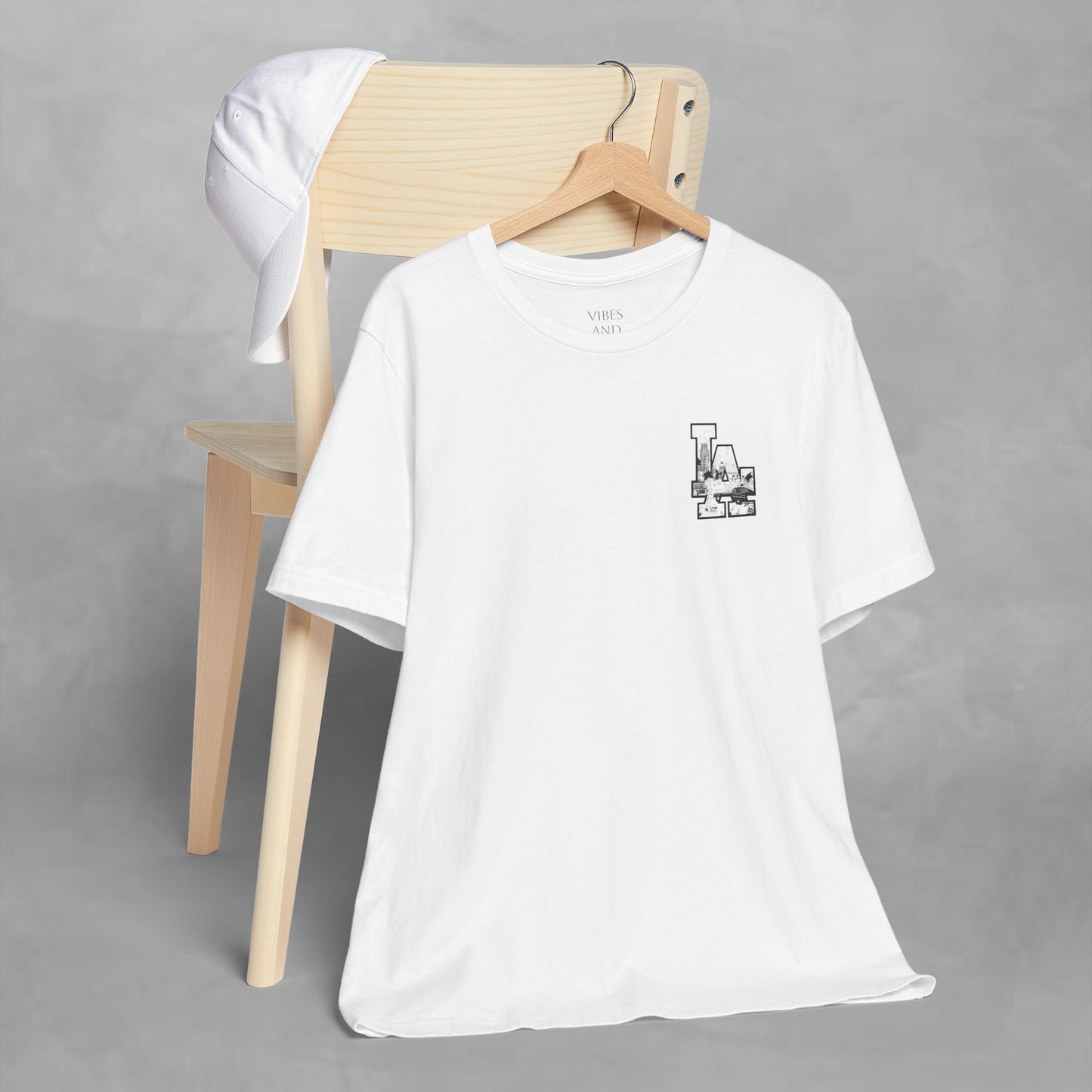 Minimalist Cityscape Pocket Tee — Small Black Line Art Chest Print