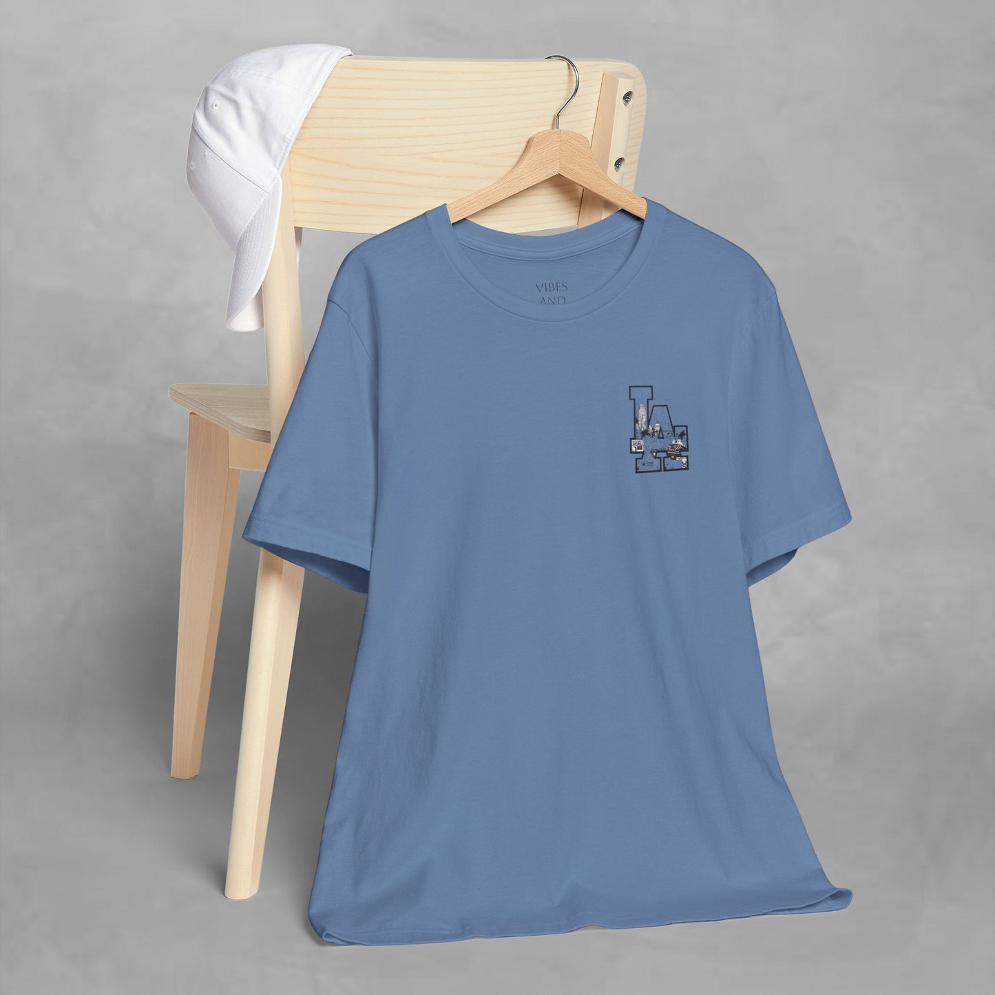 Minimalist Cityscape Pocket Tee — Small Black Line Art Chest Print